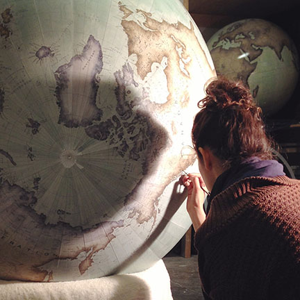 Jade Fenster hand-painting a globe at Bellerby and Co globemakers