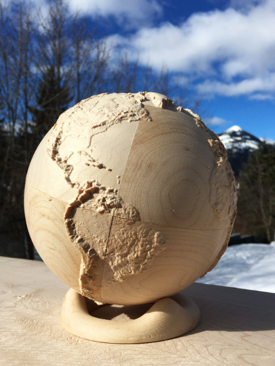 detail of fully three-dimensional 6-inch wood-carved terrestrial relief globe