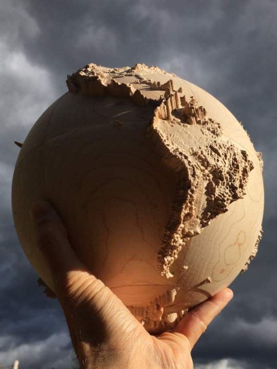 detail of fully three-dimensional 9-inch wood-carved terrestrial relief globe