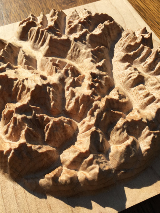 detail of three-dimensional wood-carved relief map of the Bugaboos in the Purcell Mountains, British Columbia, Canada