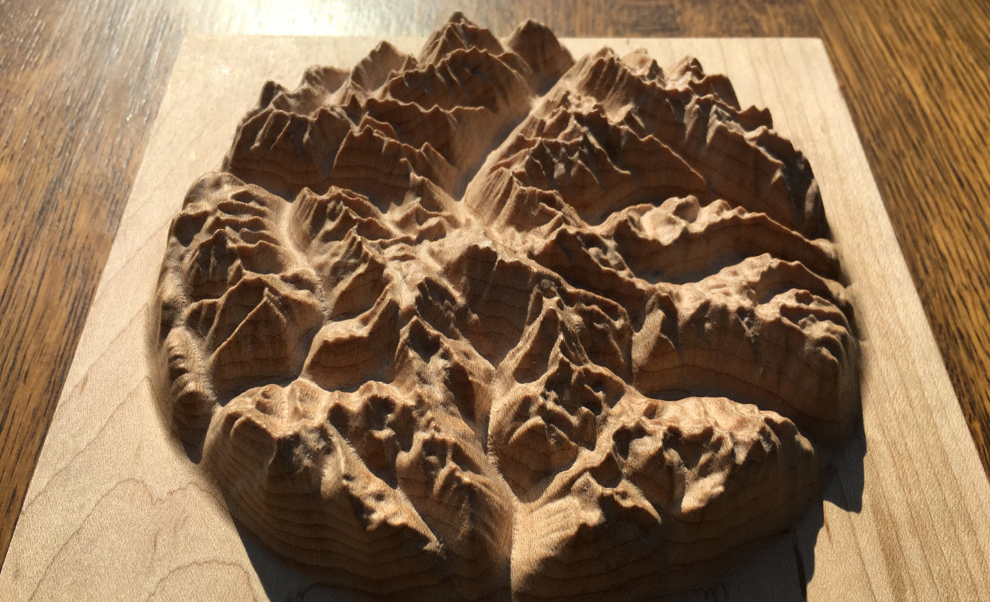 three-dimensional wood-carved relief map of the mountains around Kokanee Glacier in the Kootenays, British Columbia, Canada