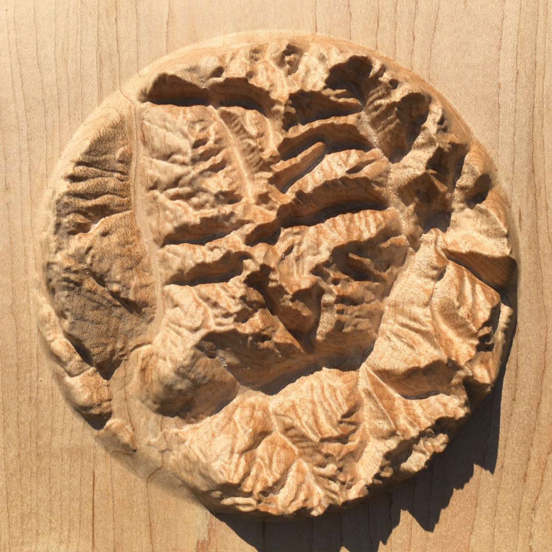 overview of three-dimensional wood-carved relief map of the mountains around Mount Revelstoke in the Selkirk Mountains, British Columbia, Canada