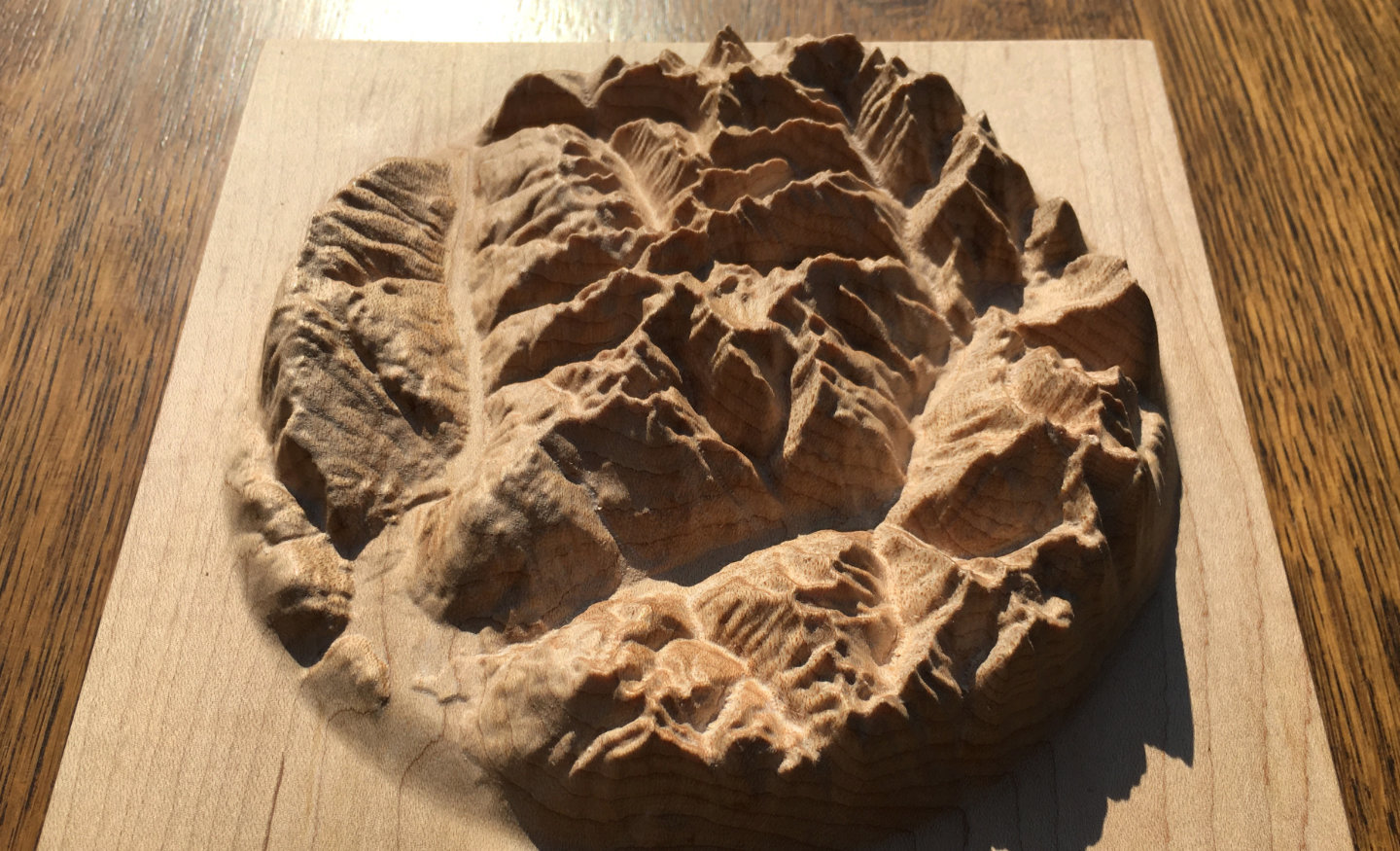 three-dimensional wood-carved relief map of the mountains around Mount Revelstoke in the Selkirk Mountains, British Columbia, Canada