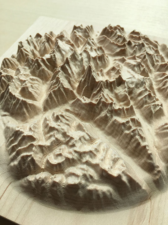 detail of three-dimensional wood-carved relief map of the Canadian Rockies around Mount Robson, British Columbia, Canada