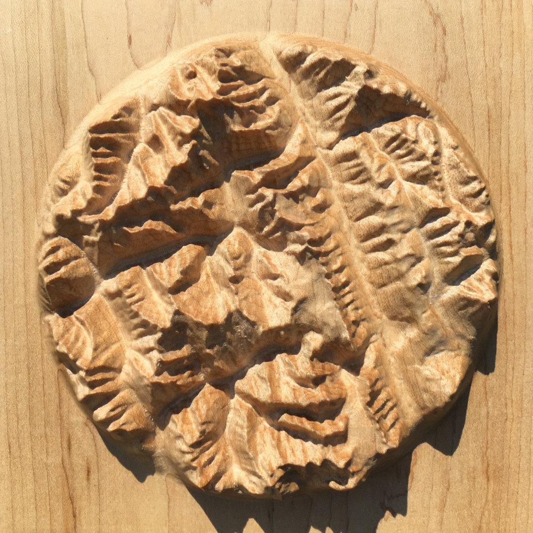 overview of three-dimensional wood-carved relief map of the mountains around Rogers Pass in Glacier National Park, British Columbia, Canada