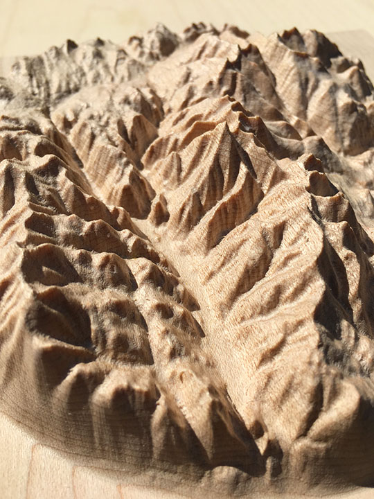 detail of three-dimensional wood-carved relief map of the mountains of the Rossland Range in the Kootenays, British Columbia, Canada