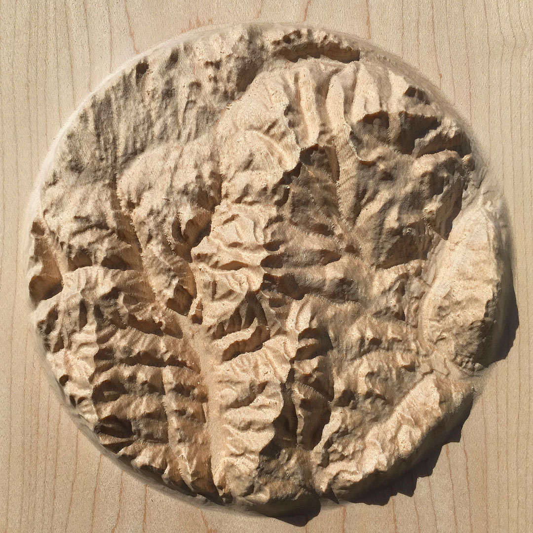 overview of three-dimensional wood-carved relief map of the mountains of the Rossland Range in the Kootenays, British Columbia, Canada