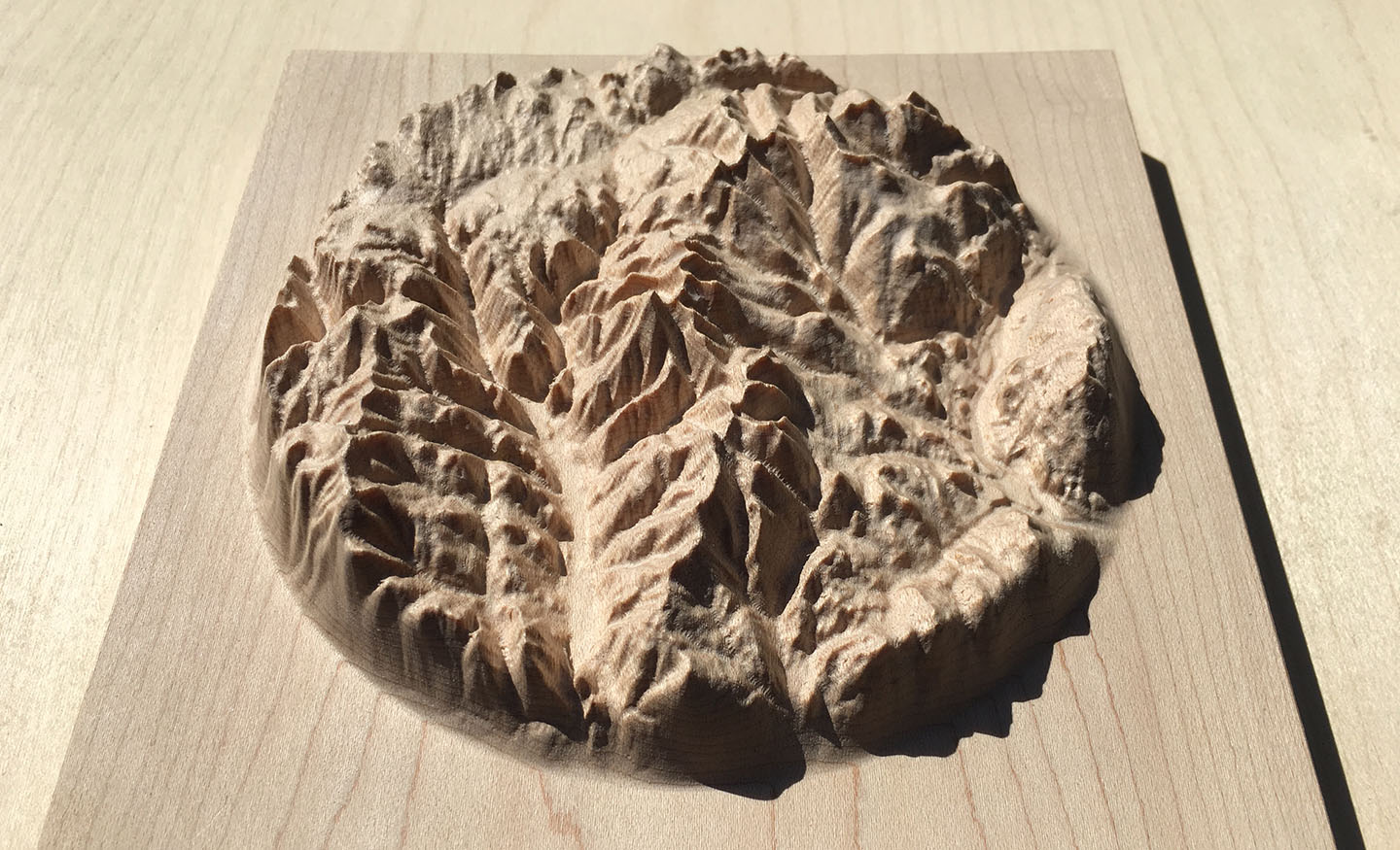 three-dimensional wood-carved relief map of the mountains of the Rossland Range in the Kootenays, British Columbia, Canada