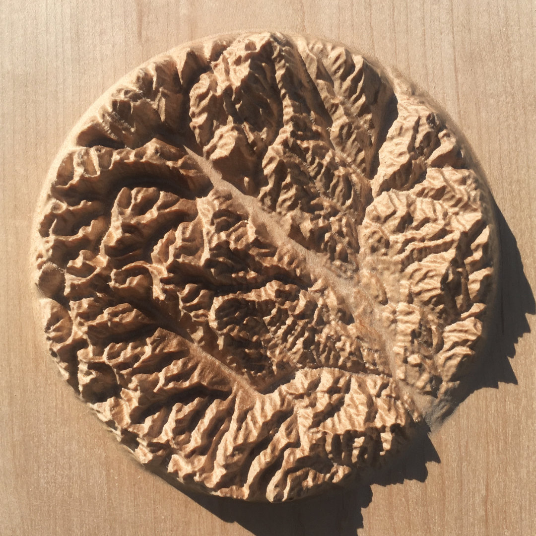 overview of three-dimensional wood-carved relief map of the mountains of the Methow Valley in the North Cascades, Washington, United States