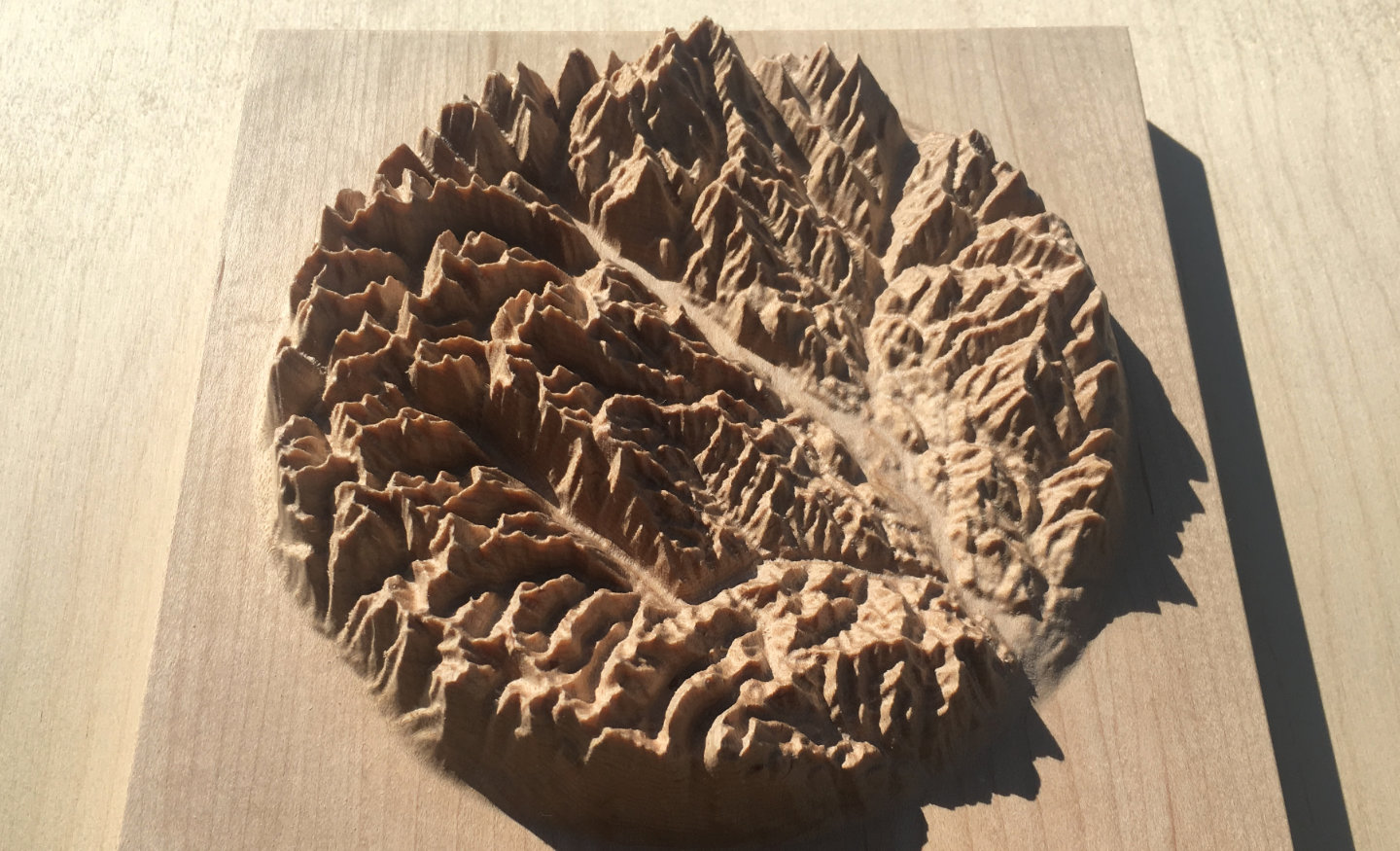 three-dimensional wood-carved relief map of the mountains of the Methow Valley in the North Cascades, Washington, United States