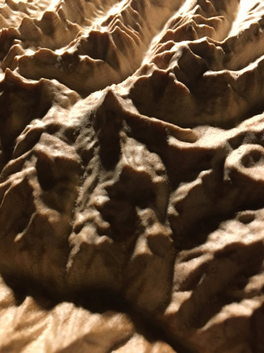 detail of three-dimensional wood-carved relief map of the San Juan Mountains around Uncompahgre Peak, Colorado, United States