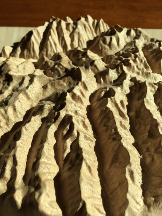 detail of three-dimensional wood-carved relief map of the San Juan Mountains around Uncompahgre Peak, Colorado, United States