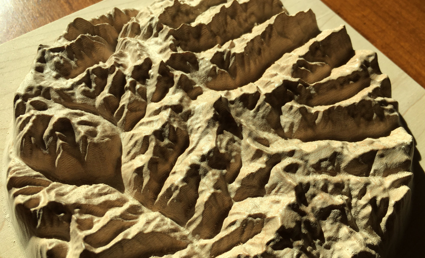 three-dimensional wood-carved relief map of the San Juan Mountains around Uncompahgre Peak, Colorado, United States