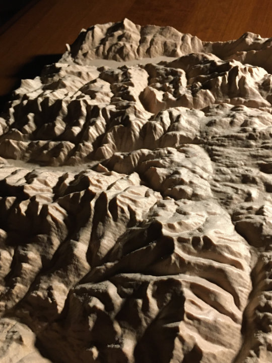 detail of three-dimensional wood-carved relief map of the mountains of the Rossland Range in the Kootenays, British Columbia, Canada
