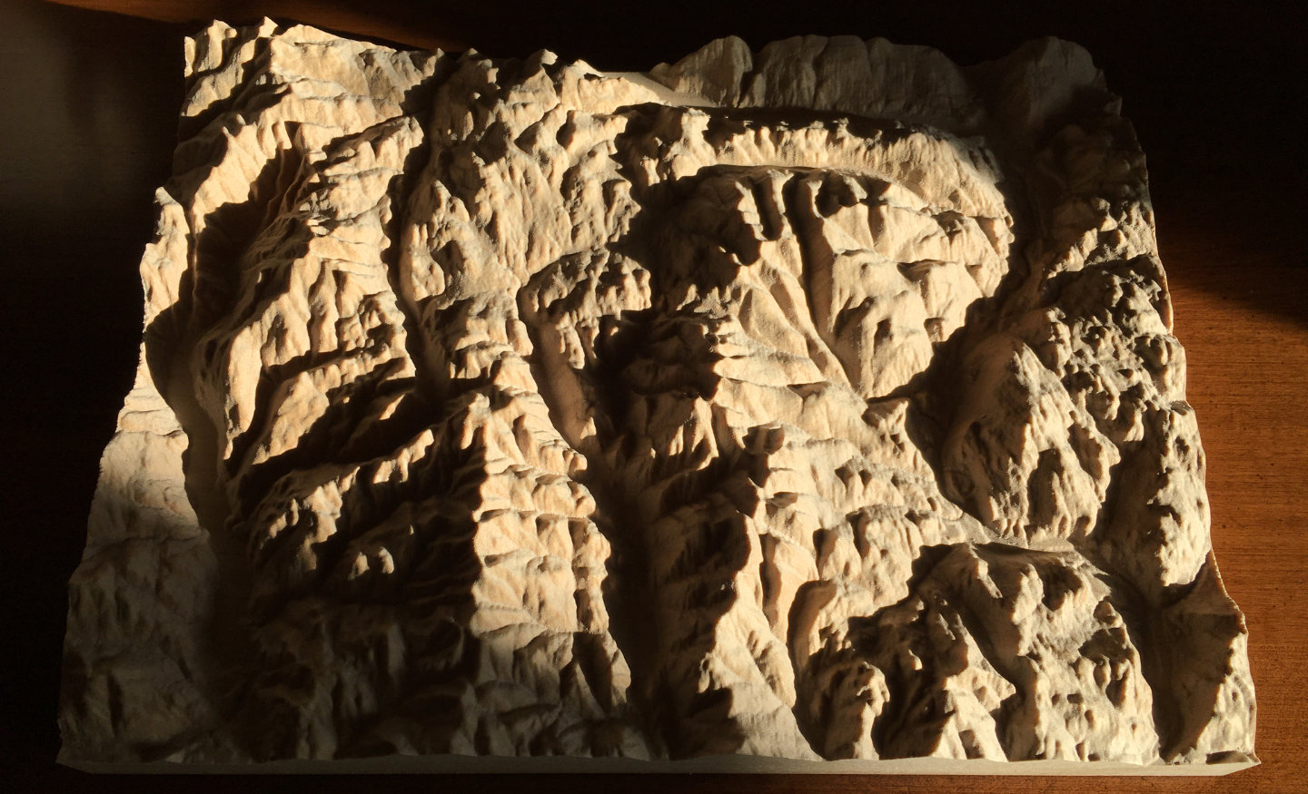 three-dimensional wood-carved relief map of the mountains of the Rossland Range in the Kootenays, British Columbia, Canada