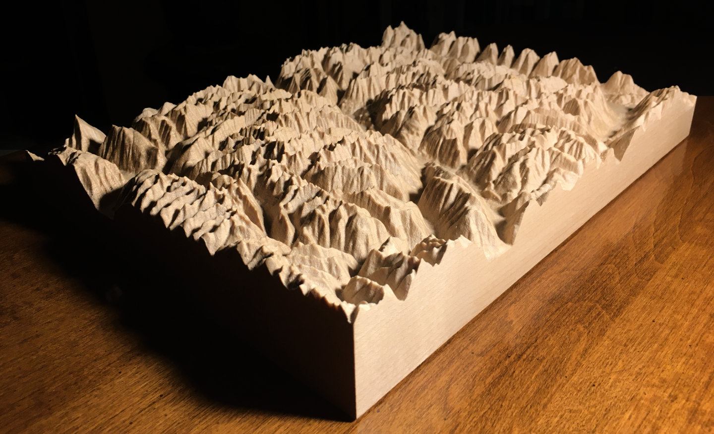 three-dimensional wood-carved relief map of the mountains of Valhalla & Kokanee Glacier, British Columbia, Canada