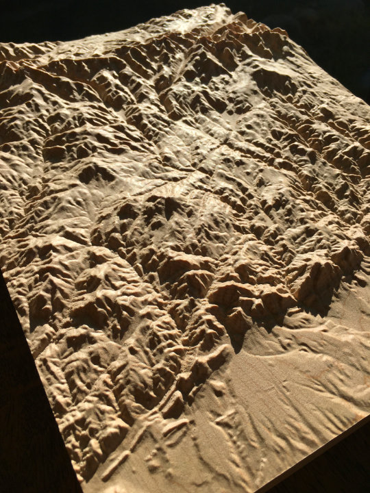 detail of three-dimensional wood-carved relief map of the Rocky Mountains near Boulder, Colorado, United States