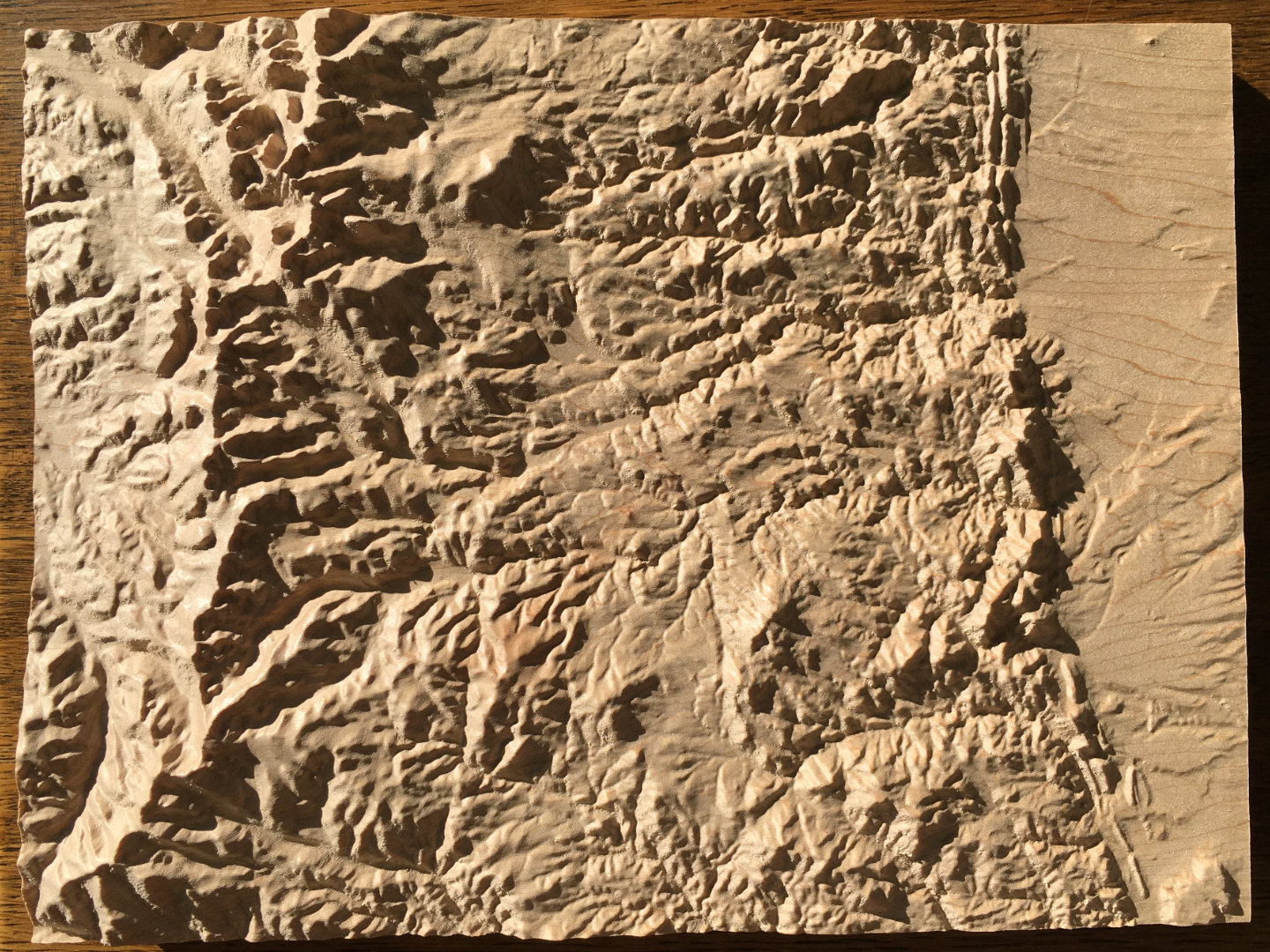 key to three-dimensional wood-carved relief map of the Rocky Mountains near Boulder, Colorado, United States