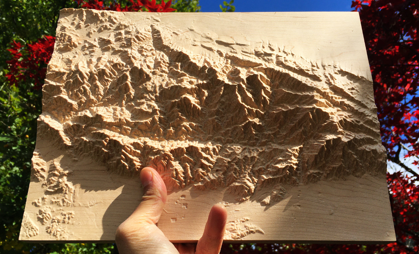 three-dimensional wood-carved relief map of the San Gabriel Mountains in Los Angeles County and San Bernardino County, California, United States