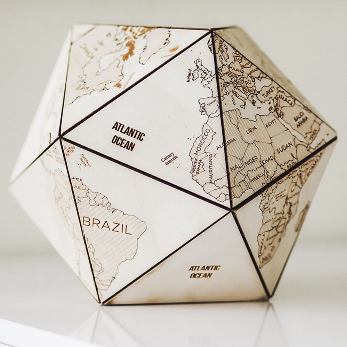 icosahedral globe handmade from engraved birch plywood triangles