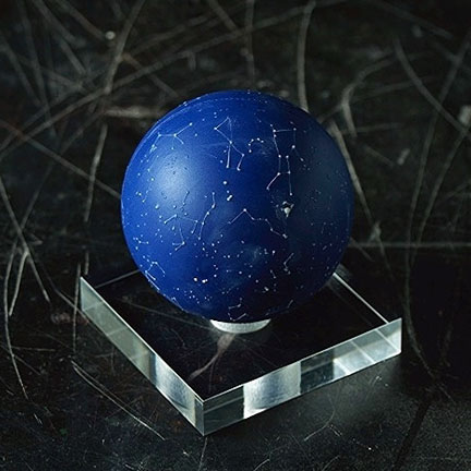 porcelain celestial globe from The Little Globe Co on a clear, square stand